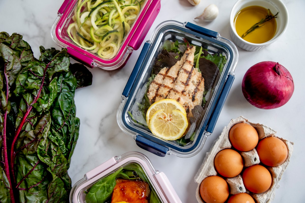 Senior nutritionist with clipboard reviewing client diet