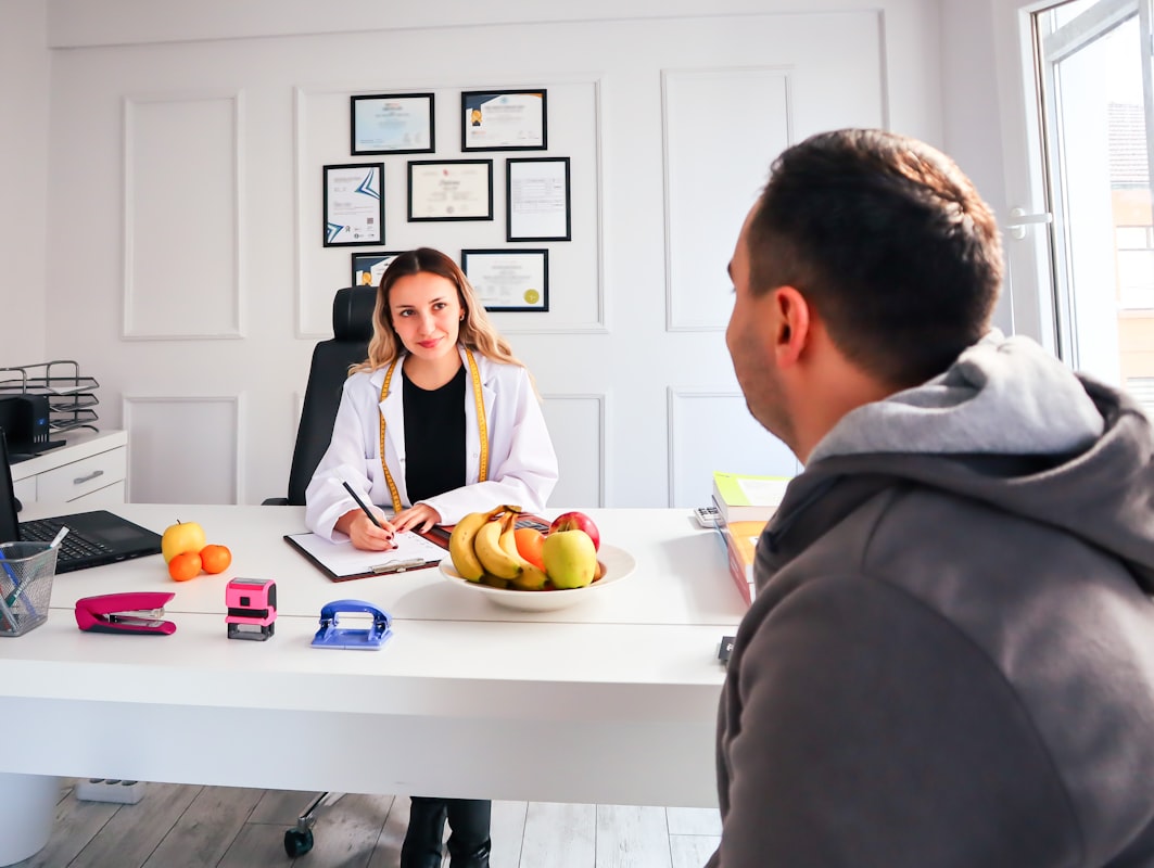 Dietitian consulting with client about food choices